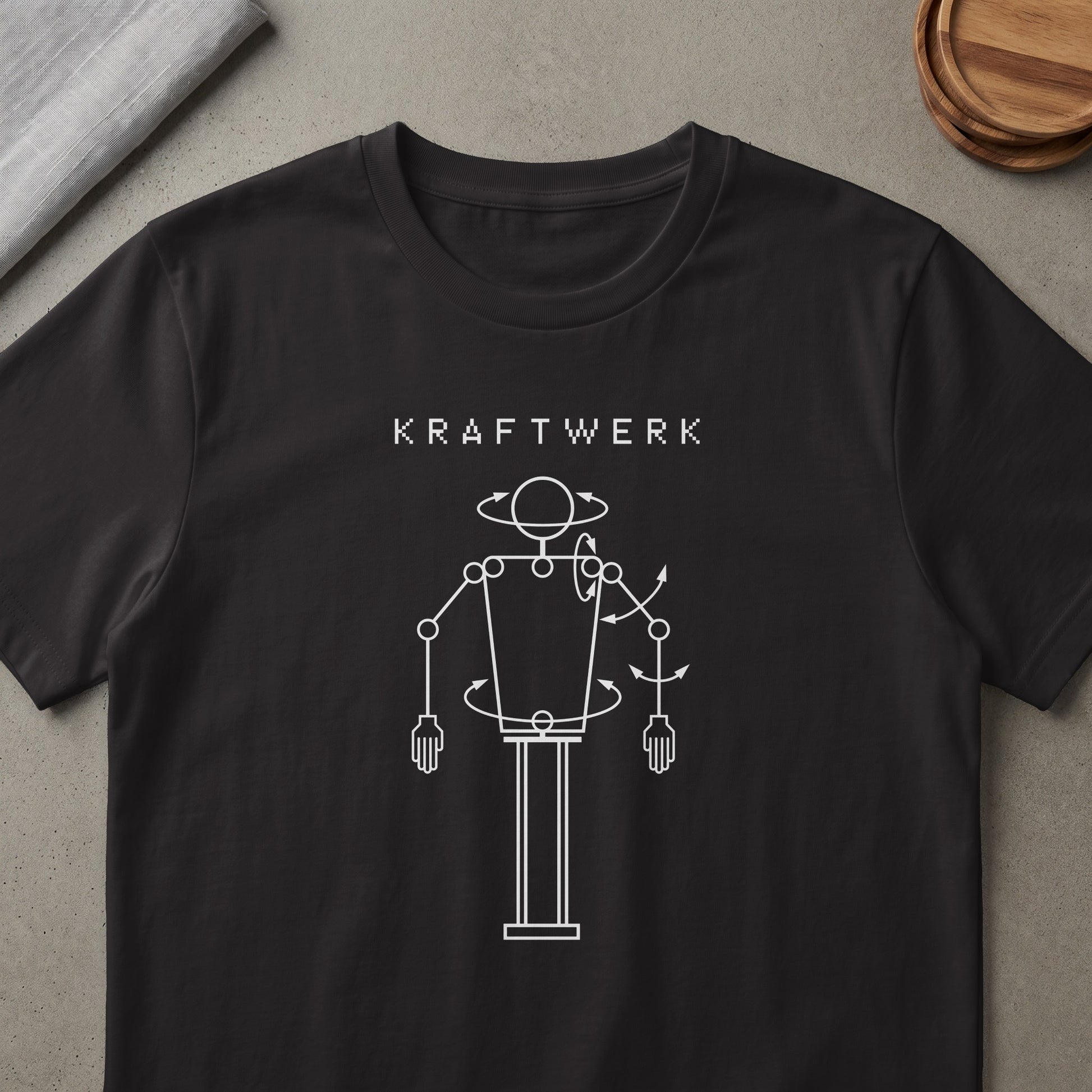 Black t-shirt with white Kraftwerk text and a line drawing of a robot.