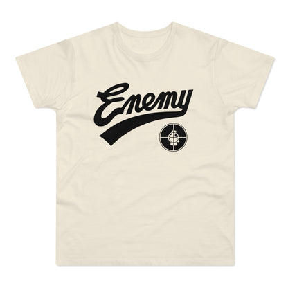 T-shirt with black "Enemy" text and a target logo on a cream background.
