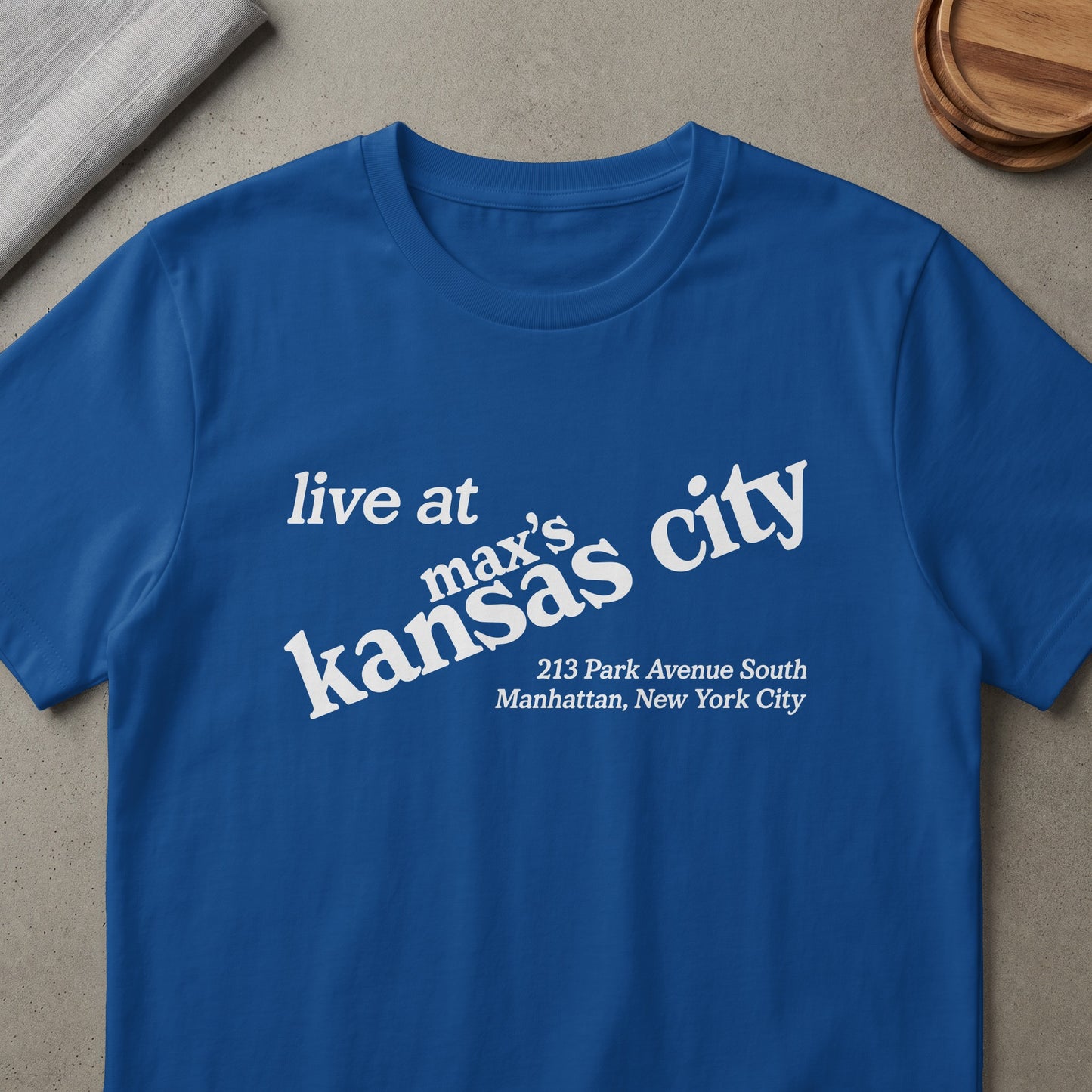 Royal blue t-shirt with white text: "live at max's kansas city 213 Park Avenue South Manhattan, New York City."
