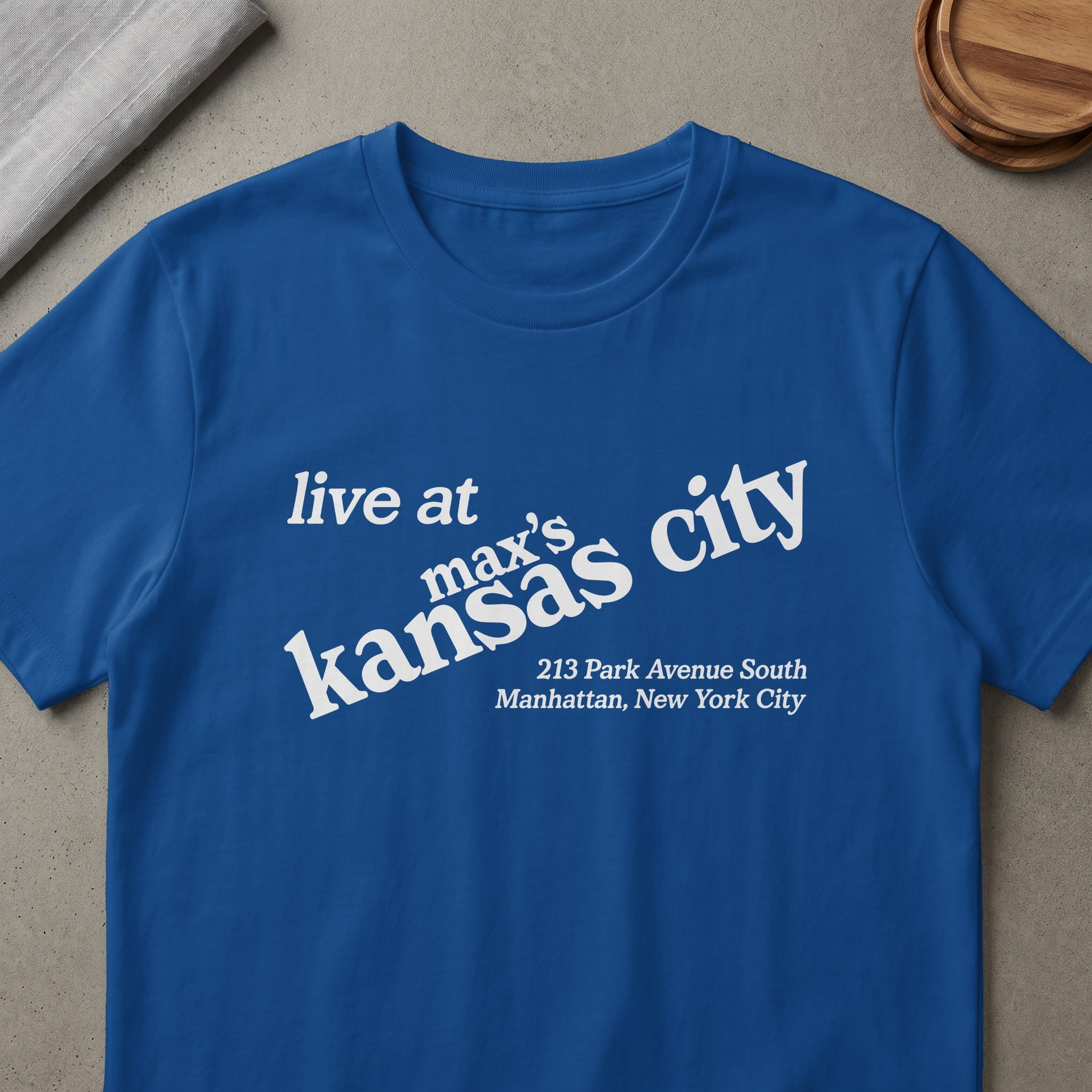 Royal blue t-shirt with white text: "live at max's kansas city 213 Park Avenue South Manhattan, New York City."