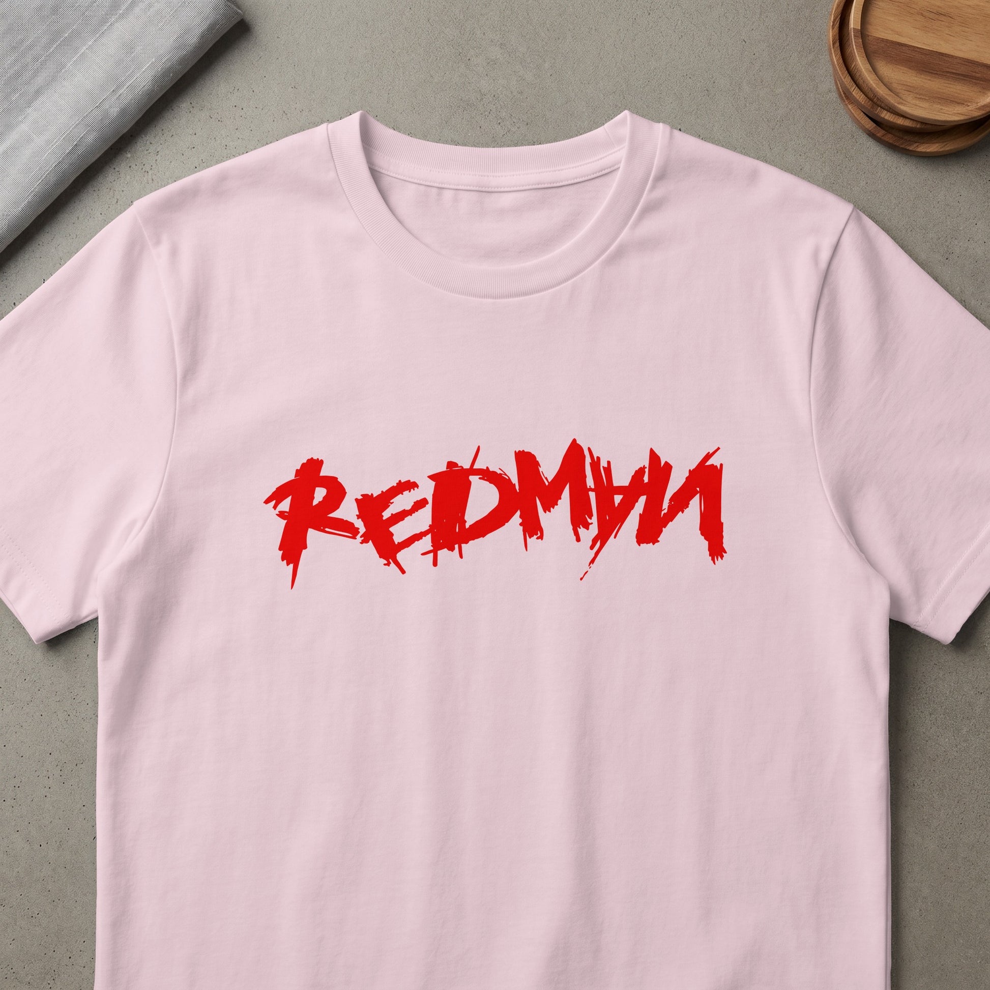 Pink t-shirt with red brushstroke text reading "REDMYW".
