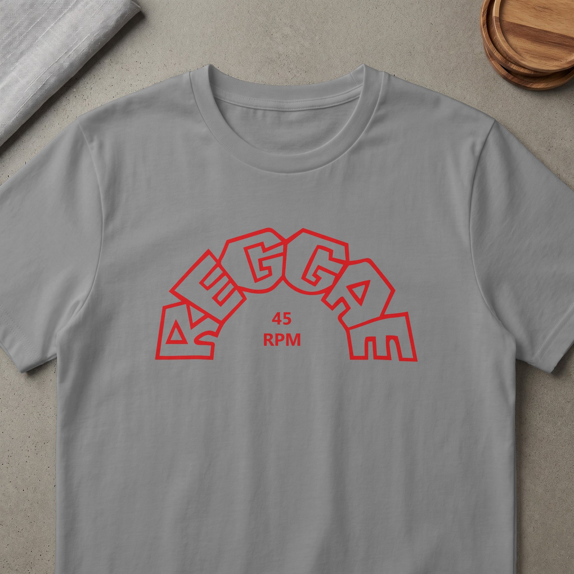 Gray t-shirt with red "Reggae 45 RPM" text in an arched font.