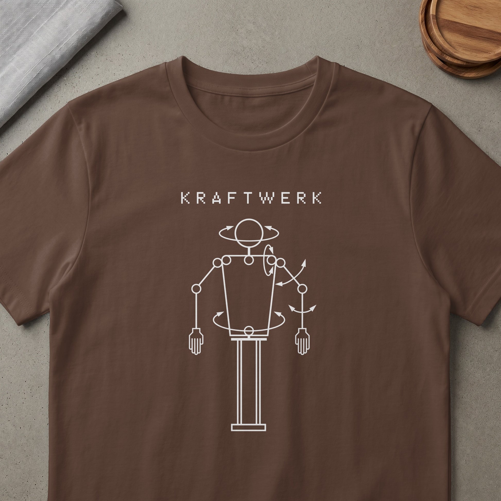 Brown t-shirt with white Kraftwerk logo and robot graphic.