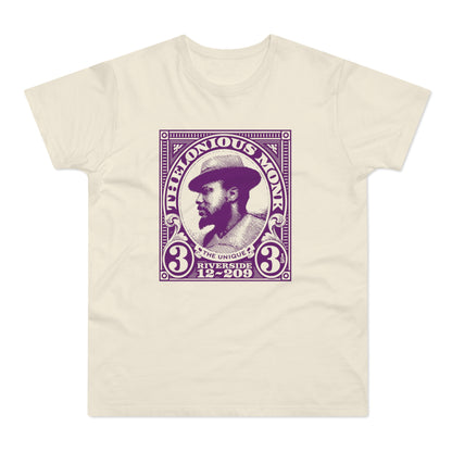 Cream t-shirt with a purple stamp graphic of Thelonious Monk.