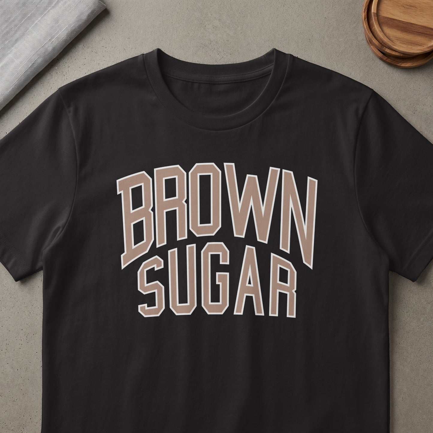 Black t-shirt with "BROWN SUGAR" text in beige and white.