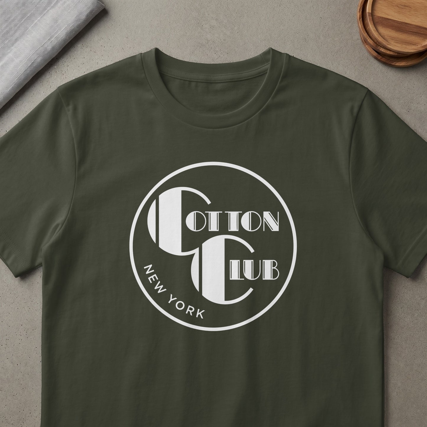 Cotton Club New York logo on a dark green t-shirt.