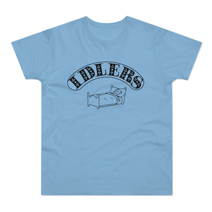 Light blue t-shirt with black text "IDLERS" above a drawing of a cat in bed.