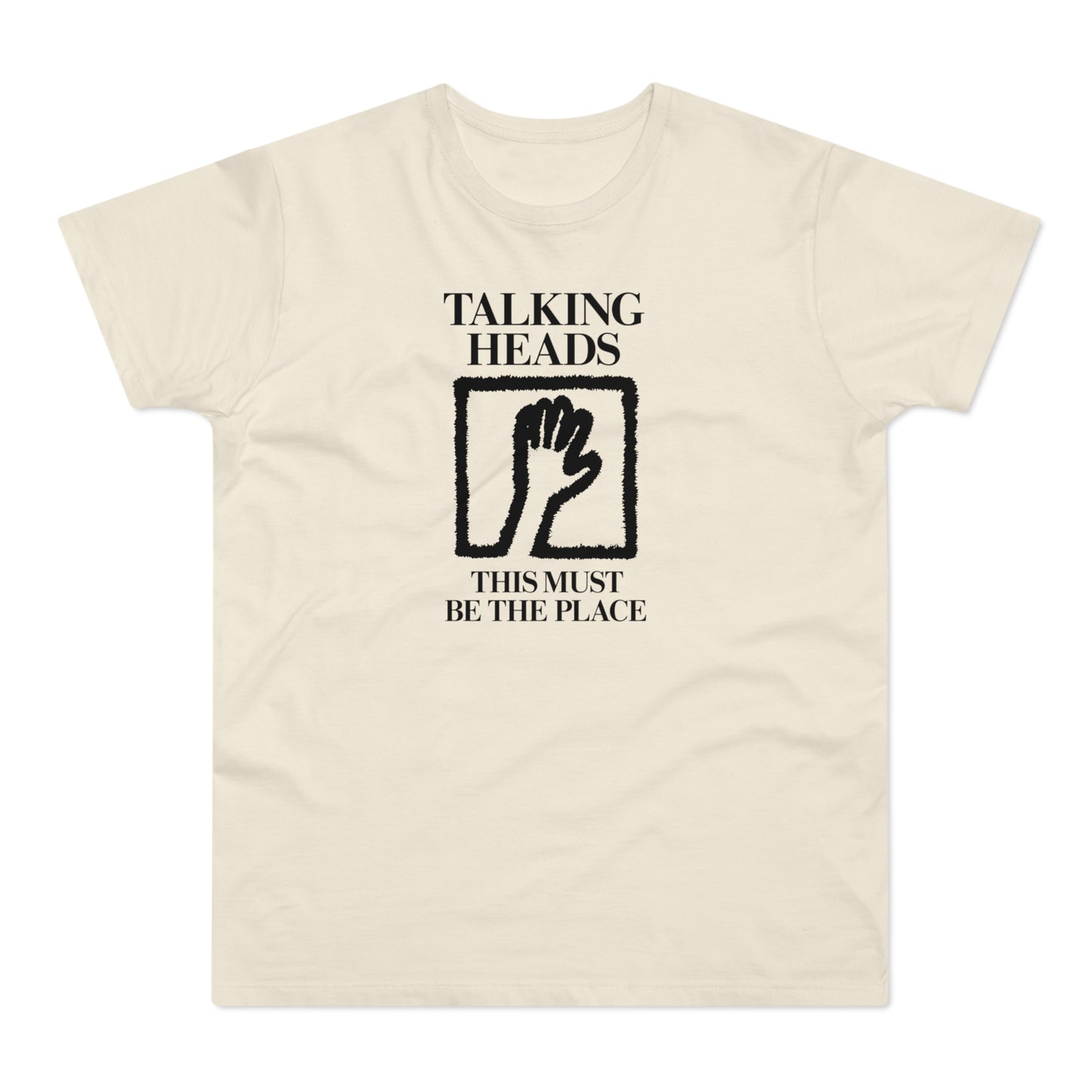 Talking Heads t-shirt with black text and hand graphic.