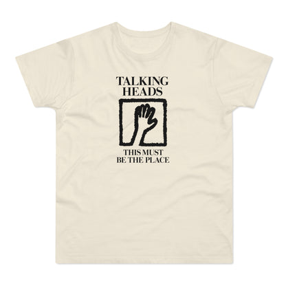 Talking Heads t-shirt with black text and hand graphic.