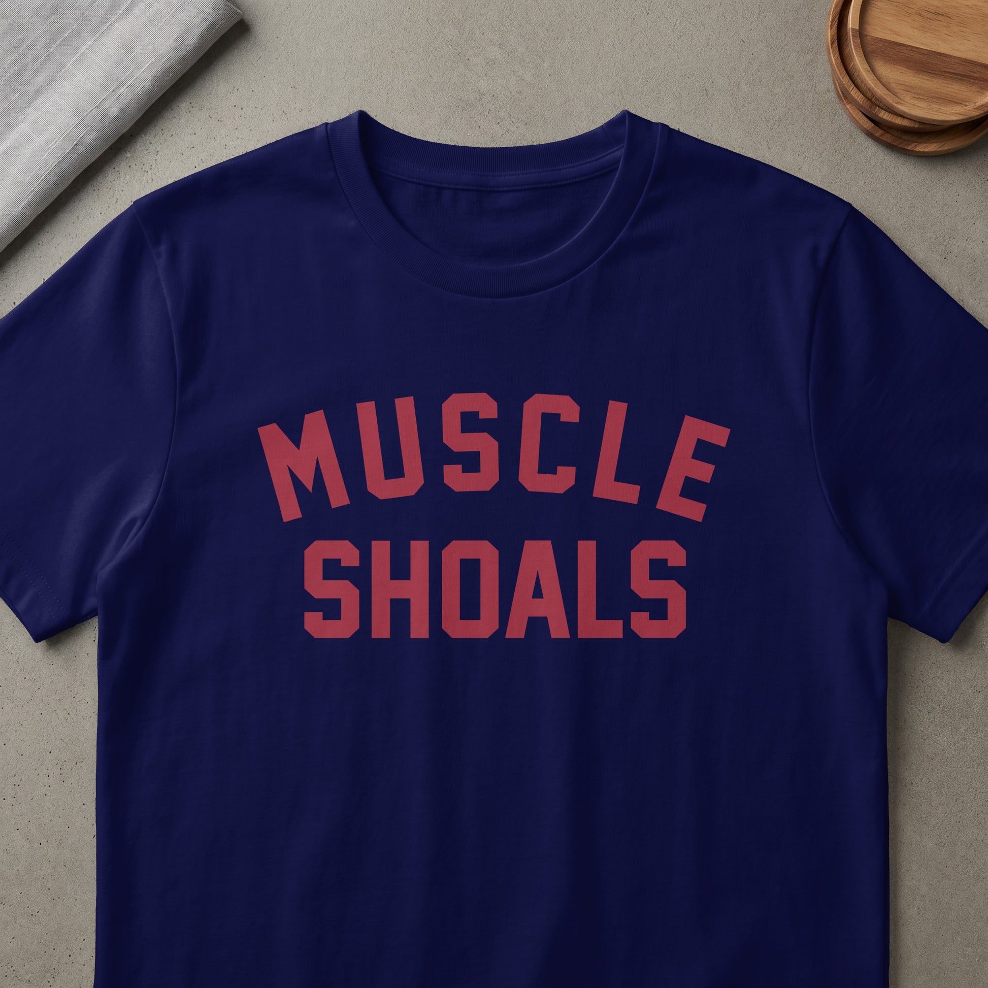 Navy t-shirt with red text that reads "MUSCLE SHOALS".