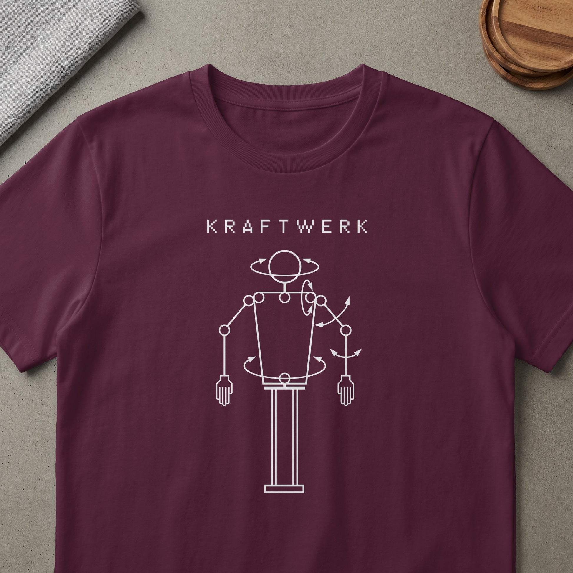 Kraftwerk t-shirt with white abstract robot graphic and text.