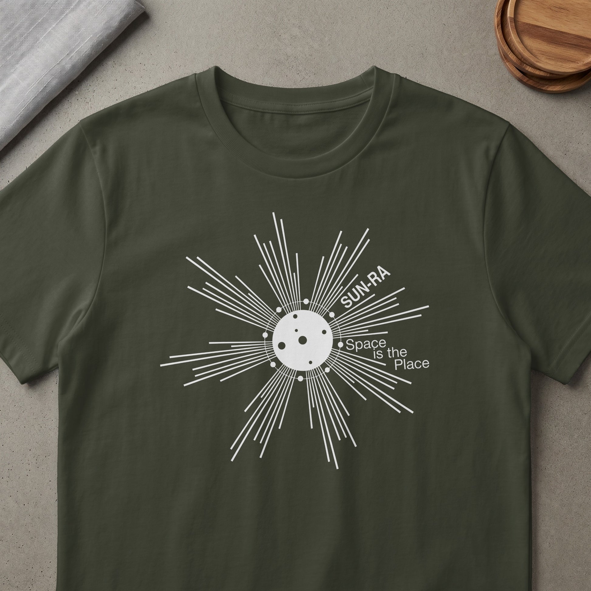 Dark green t-shirt with white Sun-Ra Space Is The Place graphic.