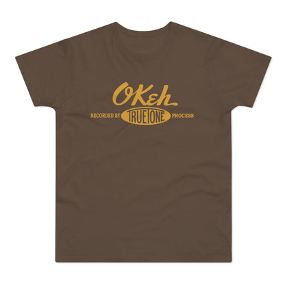 Brown t-shirt with "OKeh" and "Recorded By True One Process" in yellow.
