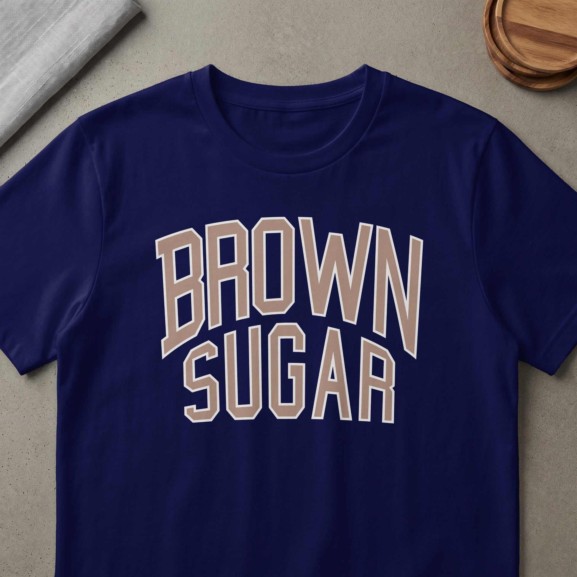 Navy blue t-shirt with "BROWN SUGAR" text in beige and white collegiate font.