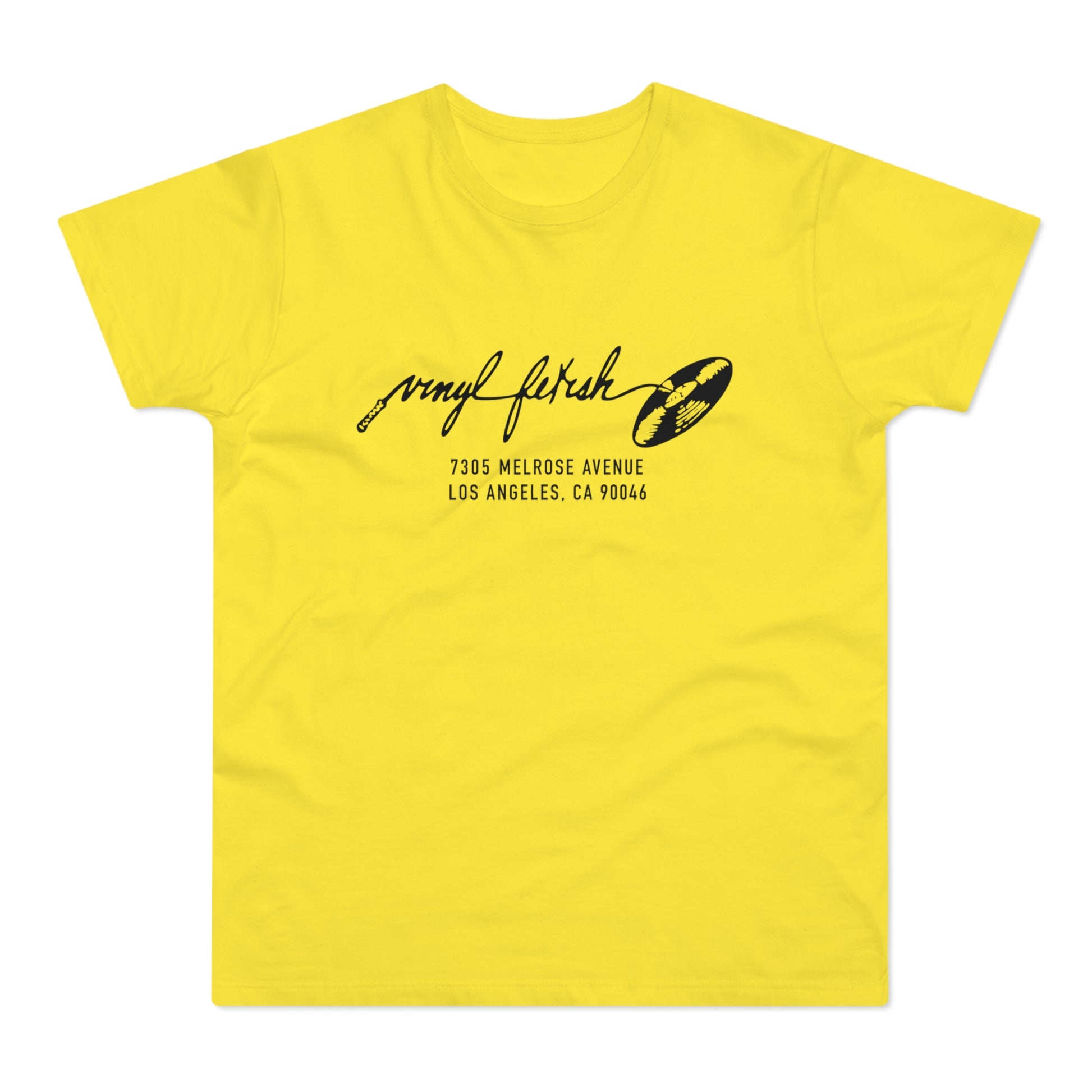 Yellow t-shirt with black graphic: "vinyl fetish" and address 7305 Melrose Avenue, Los Angeles.