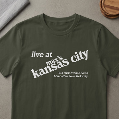Dark green t-shirt with white text: "live at max's kansas city, 213 Park Avenue South Manhattan, New York City".