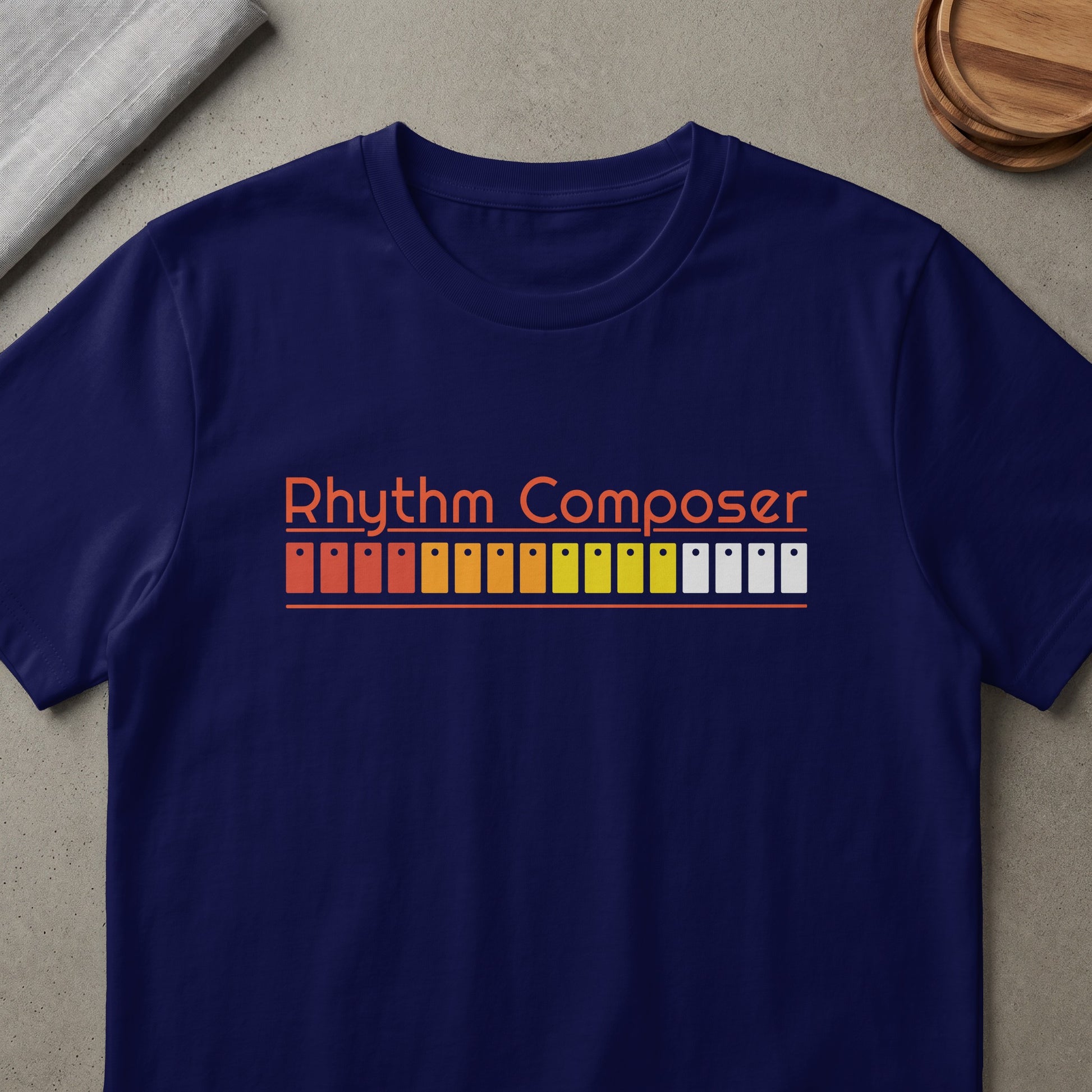Navy t-shirt with orange text "Rhythm Composer" and drum machine pads graphic.