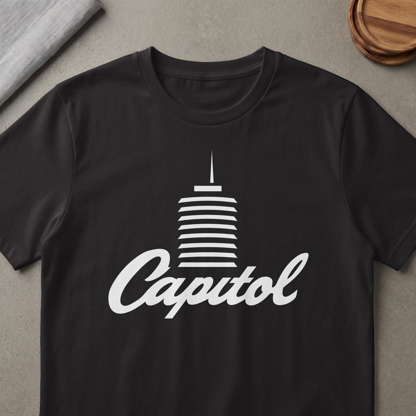 Black t-shirt with white Capitol Records building logo and cursive text.