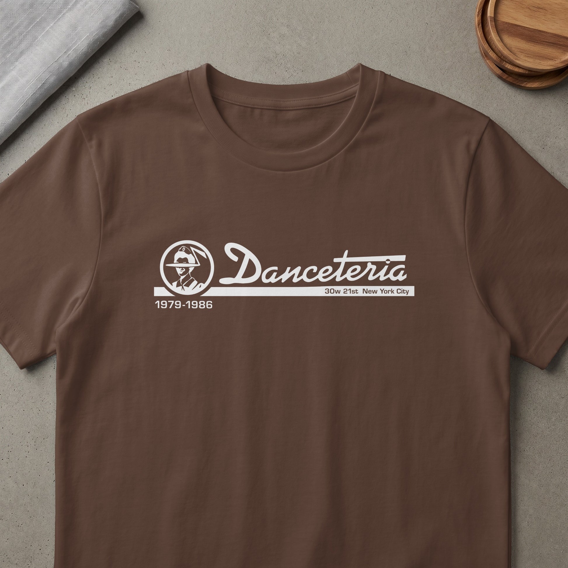 Brown t-shirt with white Danceteria logo, "30w 21st New York City", and "1979-1986".