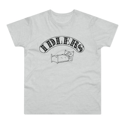 T-shirt with "IDLERS" text above a cartoon person sleeping in a bed.