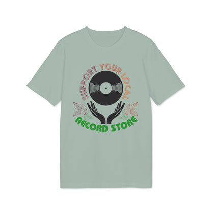 Light sage shirt with circular graphic featuring vinyl record, hands, leaves, and text.