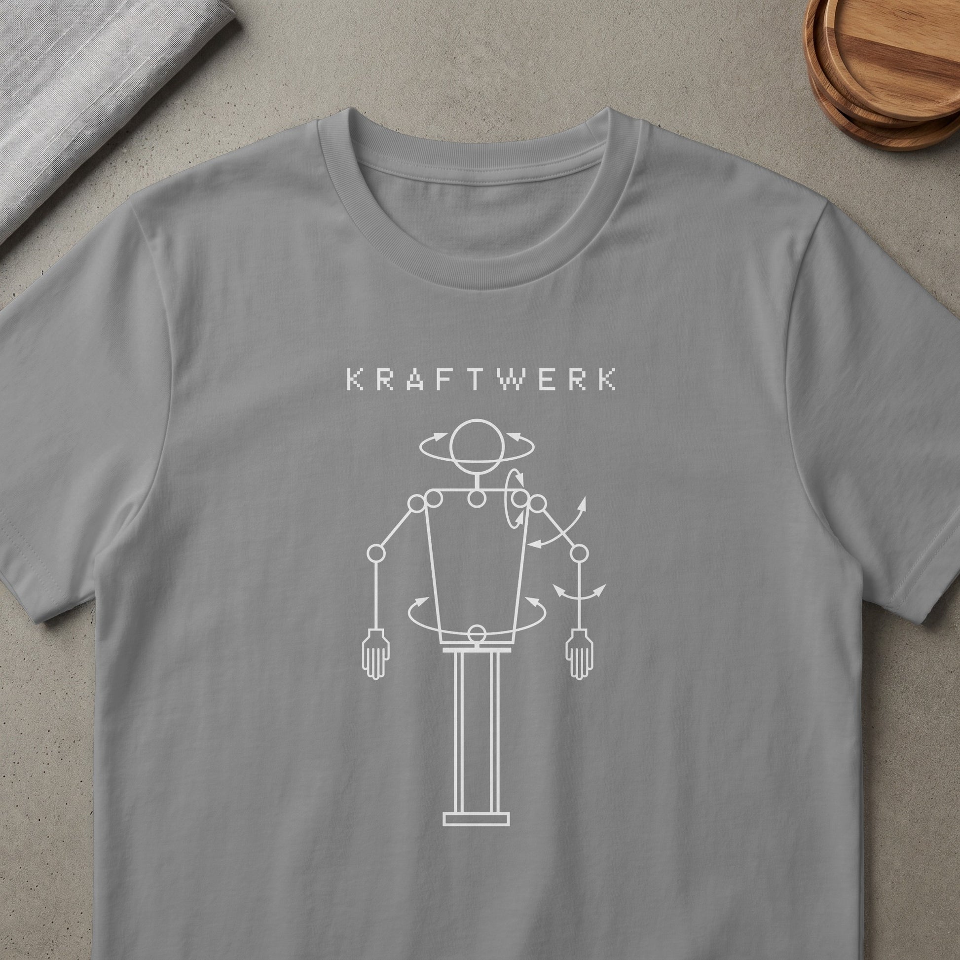 Kraftwerk logo with a white outline drawing of a robotic figure.