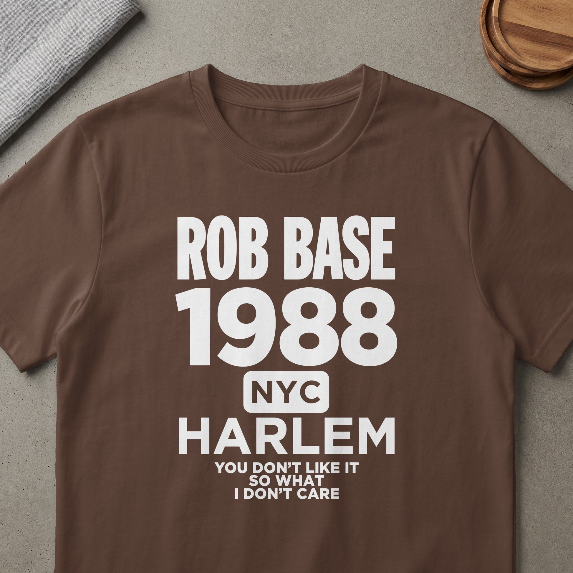 Brown t-shirt with white text: Rob Base 1988 NYC Harlem, You Don't Like It So What I Don't Care