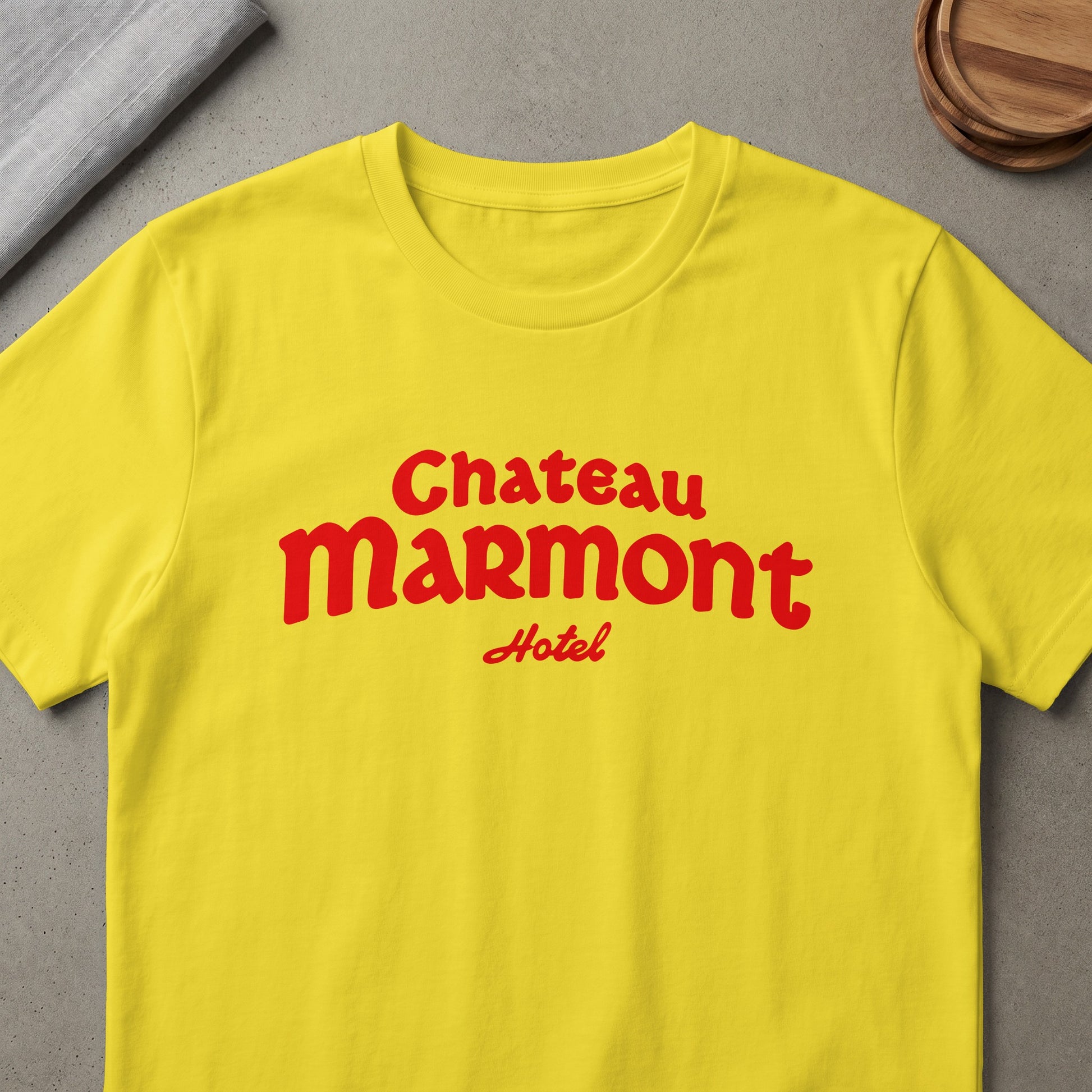Yellow t-shirt with red "Chateau Marmont Hotel" text.