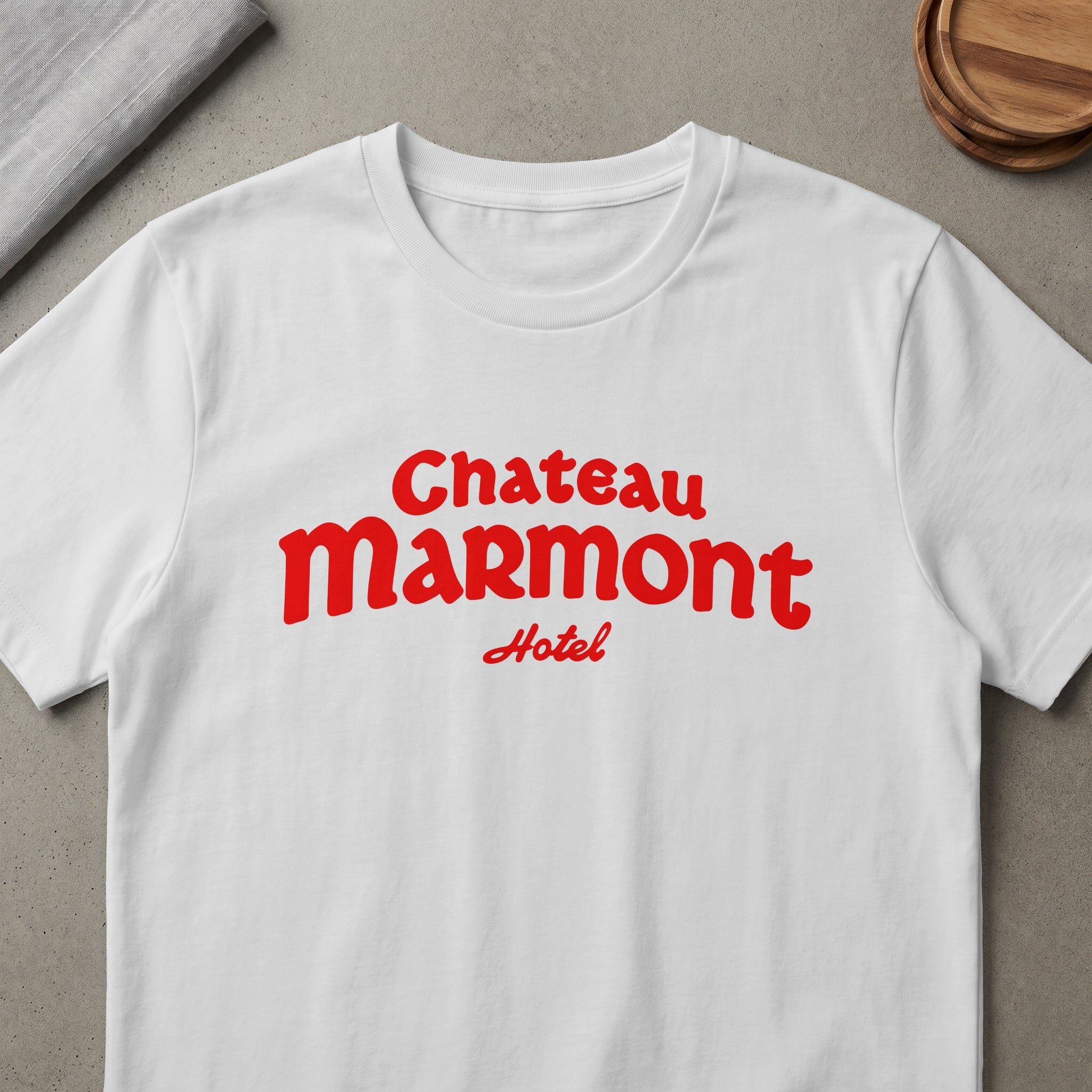 White t-shirt with red "Chateau Marmont Hotel" graphic.