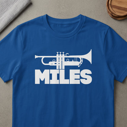 Blue t-shirt with white trumpet graphic and the word "MILES"