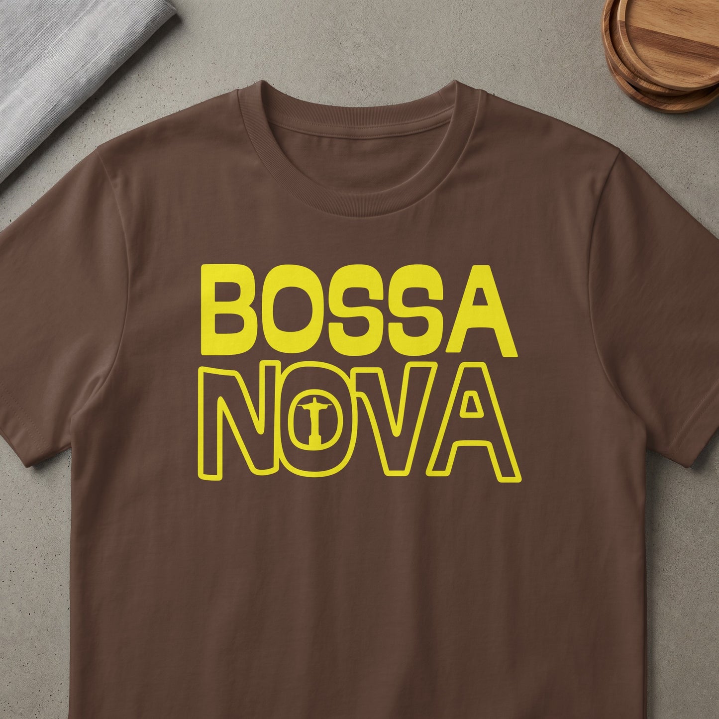 Brown t-shirt with yellow "BOSSA NOVA" text and Christ the Redeemer icon.