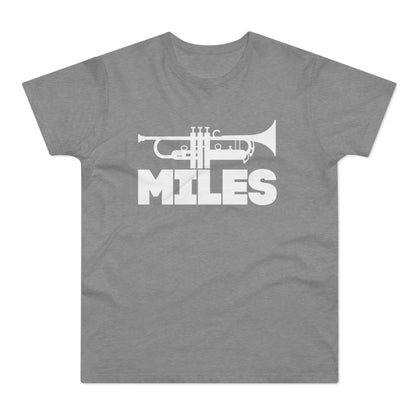 White trumpet graphic and "MILES" text on a grey t-shirt.