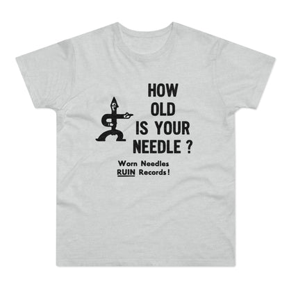 Light grey t-shirt with black graphic text "HOW OLD IS YOUR NEEDLE?" and warning.