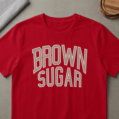Red t-shirt with "BROWN SUGAR" text in beige outline.