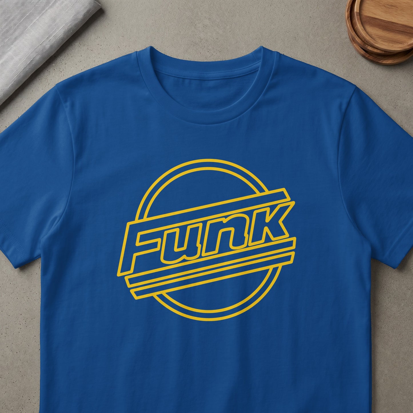 Blue t-shirt with yellow "Funk" text inside a circular outline.