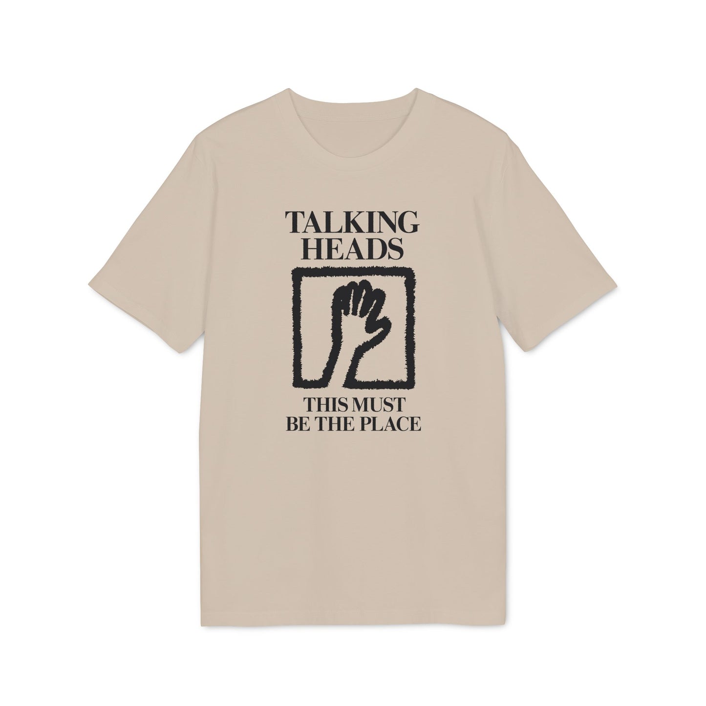 Tan t-shirt with black "Talking Heads This Must Be The Place" text and hand graphic.