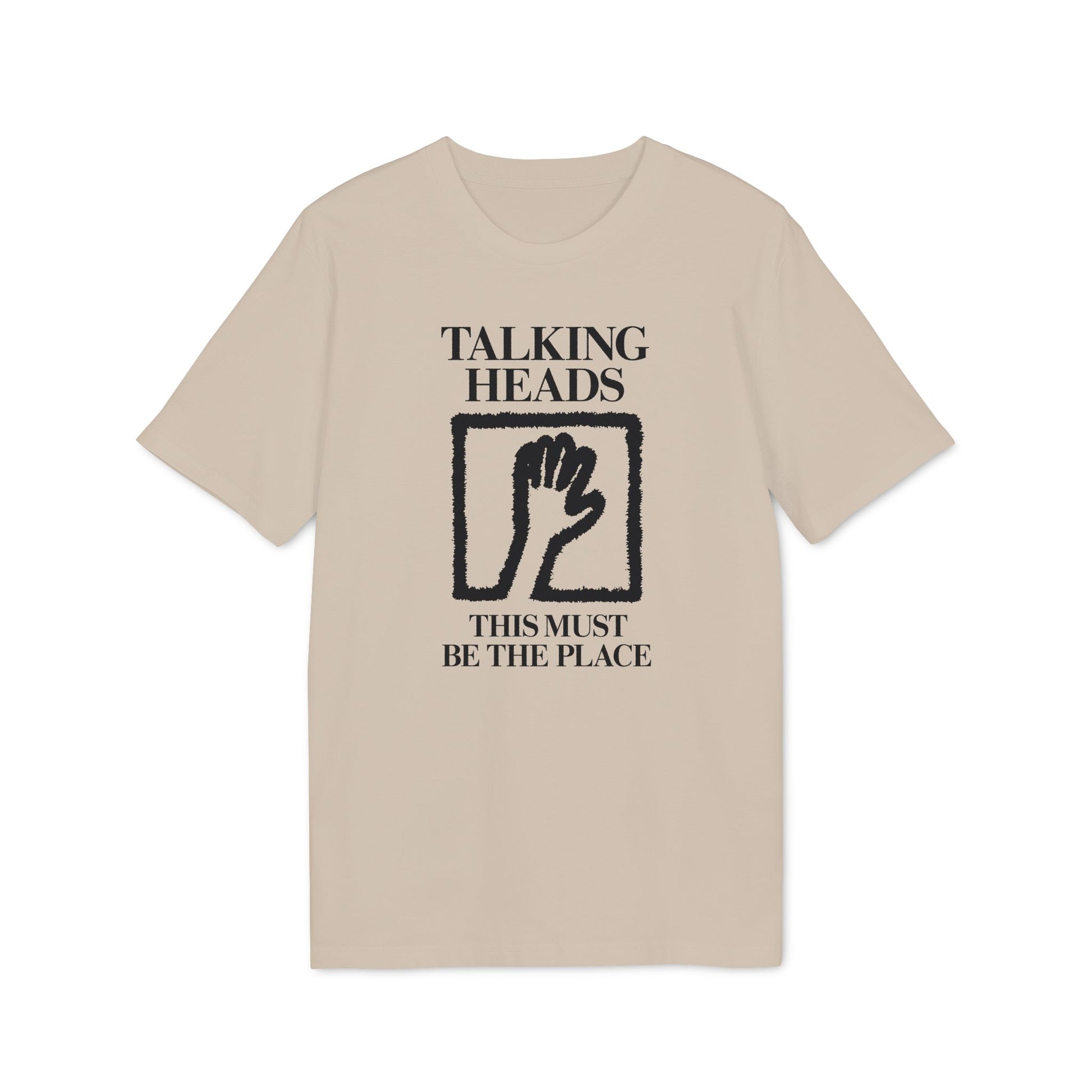 Tan t-shirt with black "Talking Heads This Must Be The Place" text and hand graphic.