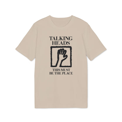 Tan t-shirt with black "Talking Heads This Must Be The Place" text and hand graphic.