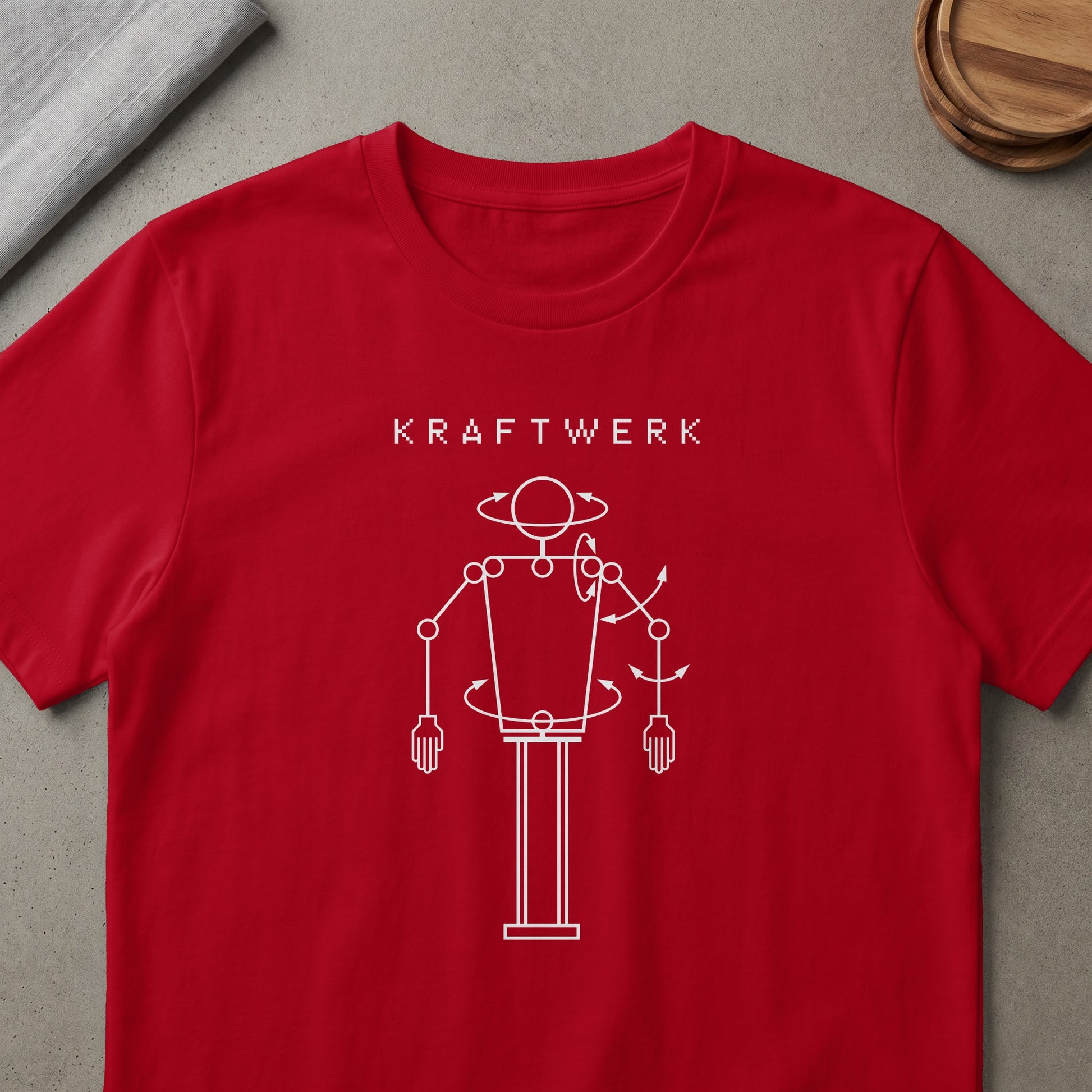 Red t-shirt with white Kraftwerk pixel text and robot figure graphic.