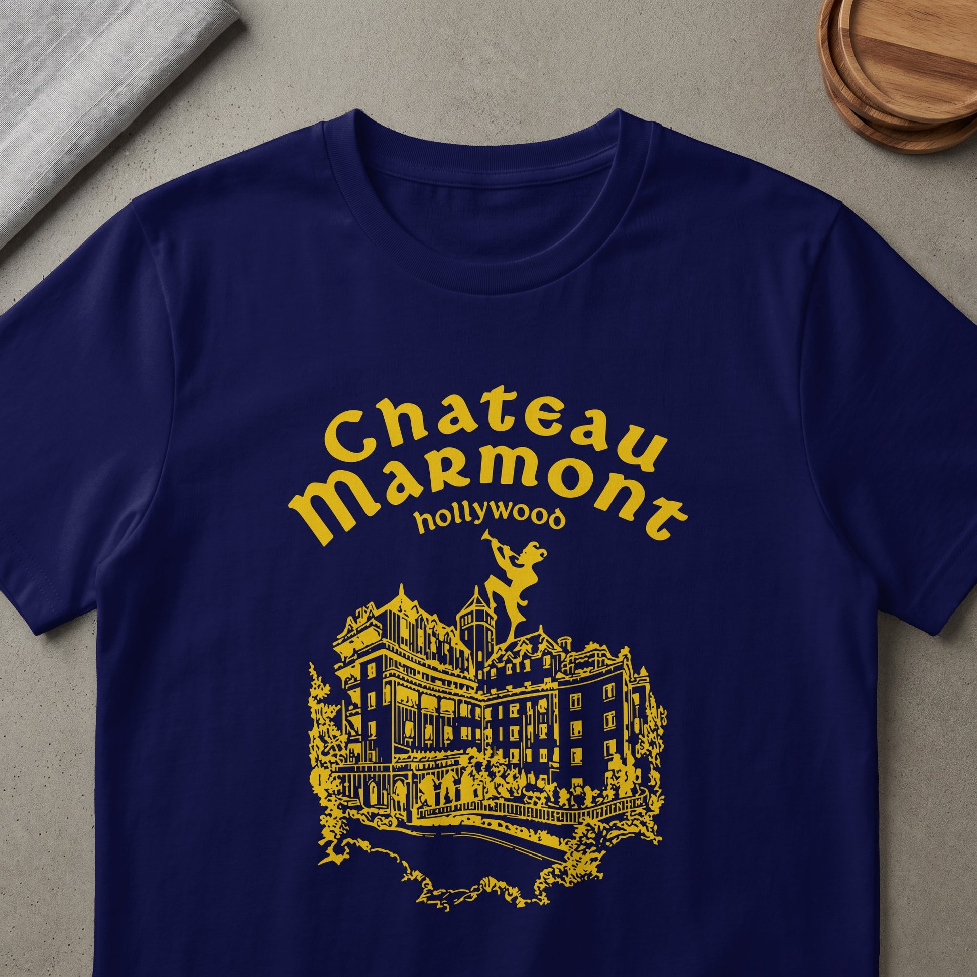 Navy t-shirt with yellow "Chateau Marmont Hollywood" text and building graphic.